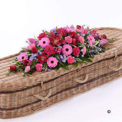 <h2>Extra Large Bright Casket Spray | Funeral Flowers</h2>
<ul>
<li>Approximate Size 50cm x 180cm (6ft)</li>
<li>Hand created classic pink, cerise and red extra-large casket spray in fresh flowers</li>
<li>To give you the best we may occasionally need to make substitutes</li>
<li>Funeral Flowers will be delivered at least 2 hours before the funeral</li>
<li>For delivery area coverage see below</li>
</ul>
<br>
<h2>Liverpool Flower Delivery</h2>
<p>We have a wide selection of casket flowers offered for Liverpool Flower Delivery. Casket flowers can be provided for you in Liverpool, Merseyside and we can organize Funeral flower deliveries for you nationwide. Funeral Flowers can be delivered to the Funeral directors or a house address. They can not be delivered to the crematorium or the church.</p>
<br>
<h2>Flower Delivery Coverage</h2>
<p>Our shop delivers funeral flowers to the following Liverpool postcodes L1 L2 L3 L4 L5 L6 L7 L8 L11 L12 L13 L14 L15 L16 L17 L18 L19 L24 L25 L26 L27 L36 L70 If your order is for an area outside of these we can organise delivery for you through our network of florists. We will ask them to make as close as possible to the image but because of the difference in stock and sundry items it may not be exact.</p>
<br>
<h2>Liverpool Funeral Flowers | Casket Flowers</h2>
<p>This bright extra-large casket spray has been loving handcrafted by our expert florists. Featuring a classic selection of flowers in pink, red and cerise including large-headed roses, carnations, gerberas and Oriental lilies complemented by luscious green foliage.</p>
<br>
<p>Funeral Casket Flowers the main tribute and are sometimes, depending on the family's wishes, the only flower arrangement. They are usually chosen by the immediate family.</p>
<br>
<p>Casket sprays are placed directly on top of the coffin. They range from 3ft - 6ft. Smaller sizes will often be selected if there are other items to go on the coffin with the spray.</p>
<br>
<p>The sprays are large diamond shape tributes. The flowers are arranged in floral foam, which means the flowers have a water source meaning they look their very best for the day.</p>
<br>
<p>Extra-Large size contains 6 cerise large-headed roses, 6 red large-headed roses, 10 cerise gerberas, 5 pink Oriental lilies, 5 lilac Septemer flower, 10 cerise carnations and seasonal mixed foliage.</p>
<br>
<h2>Best Florist in Liverpool</h2>
<p>Trust Award-winning Liverpool Florist, Booker Flowers and Gifts, to deliver funeral flowers fitting for the occasion delivered in Liverpool, Merseyside and beyond. Our funeral flowers are handcrafted by our team of professional fully qualified who not only lovingly hand make our designs but hand-deliver them, ensuring all our customers are delighted with their flowers. Booker Flowers and Gifts your local Liverpool Flower shop.</p>
<br>
<p><em>Janice Crane - 5 Star Review on Google - Funeral Florist Liverpool</em></p>
<br>
<p><em>I recently had to order a floral tribute for my sister in laws funeral and the Booker Flowers team created a beautifully stunning arrangement. Thank you all so much, Janice Crane.</em></p>